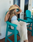 Blue and white strapless one piece with cowboy hat