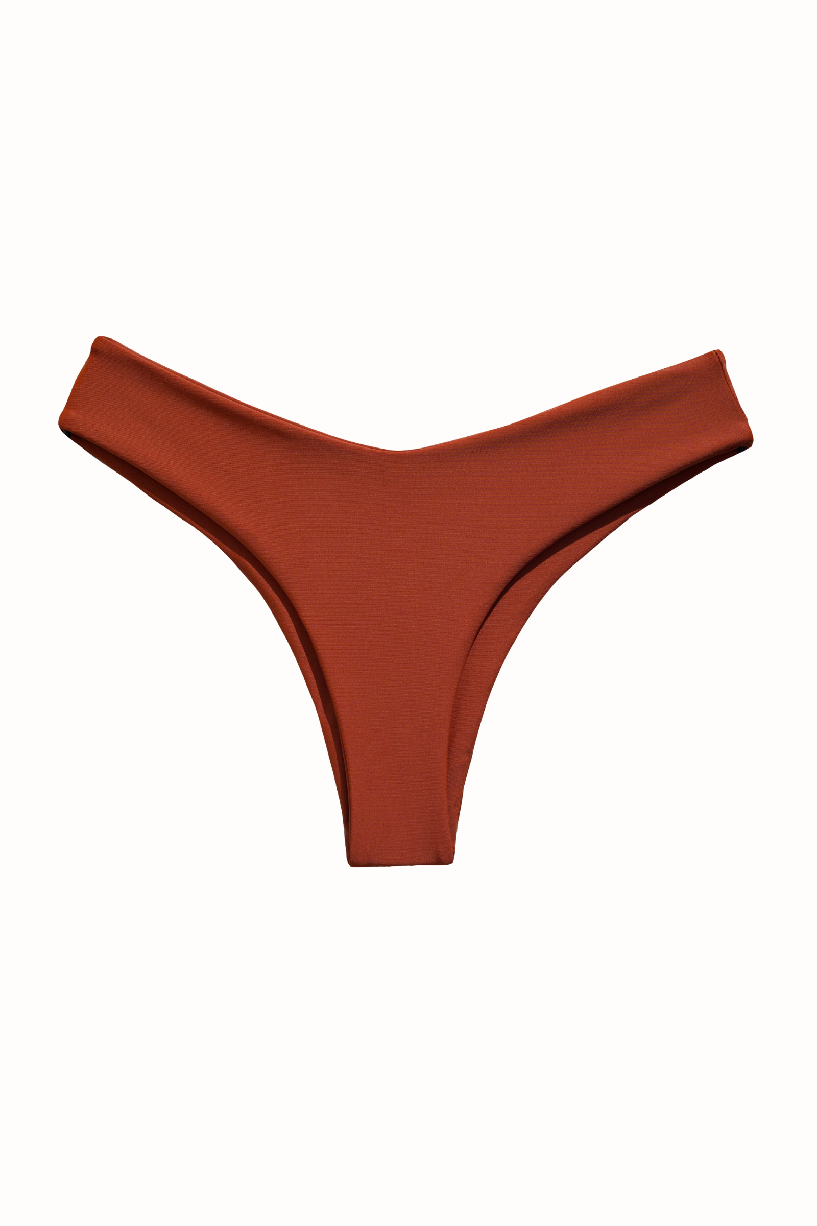 This image features the "Kate Bikini Bottom" in a rich, earthy hue of Canela. The bikini bottom is designed to sit higher on the hips, providing a flattering slimming fit that accentuates the figure.