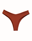 This image features the "Kate Bikini Bottom" in a rich, earthy hue of Canela. The bikini bottom is designed to sit higher on the hips, providing a flattering slimming fit that accentuates the figure.